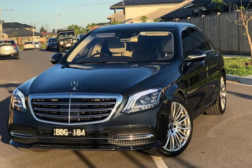 A black shiny car parked outside